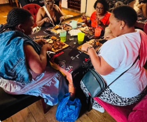 Family gathered around a table full of dishes