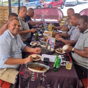 Group of men sharing a meal together