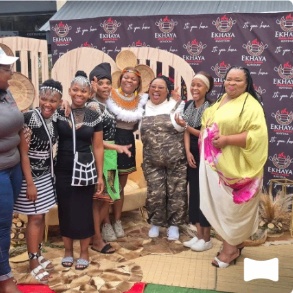 Women in traditional dress celebrating at Ekhaya